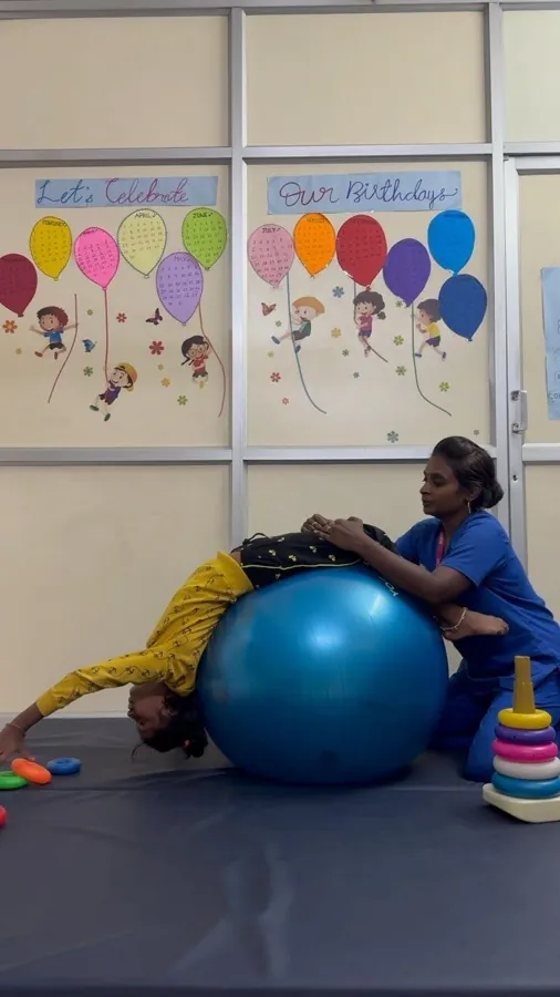 A therapist supporting a child during a play session